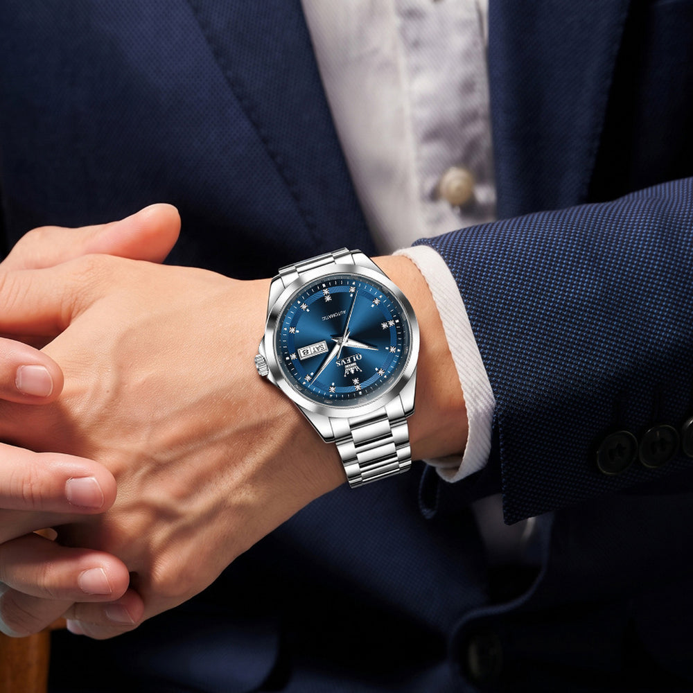 OLEVS 7136 Silver Blue watch worn with suit