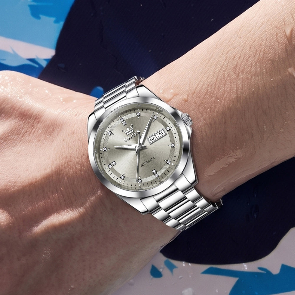 OLEVS 7136 Silver Gray watch worn near water