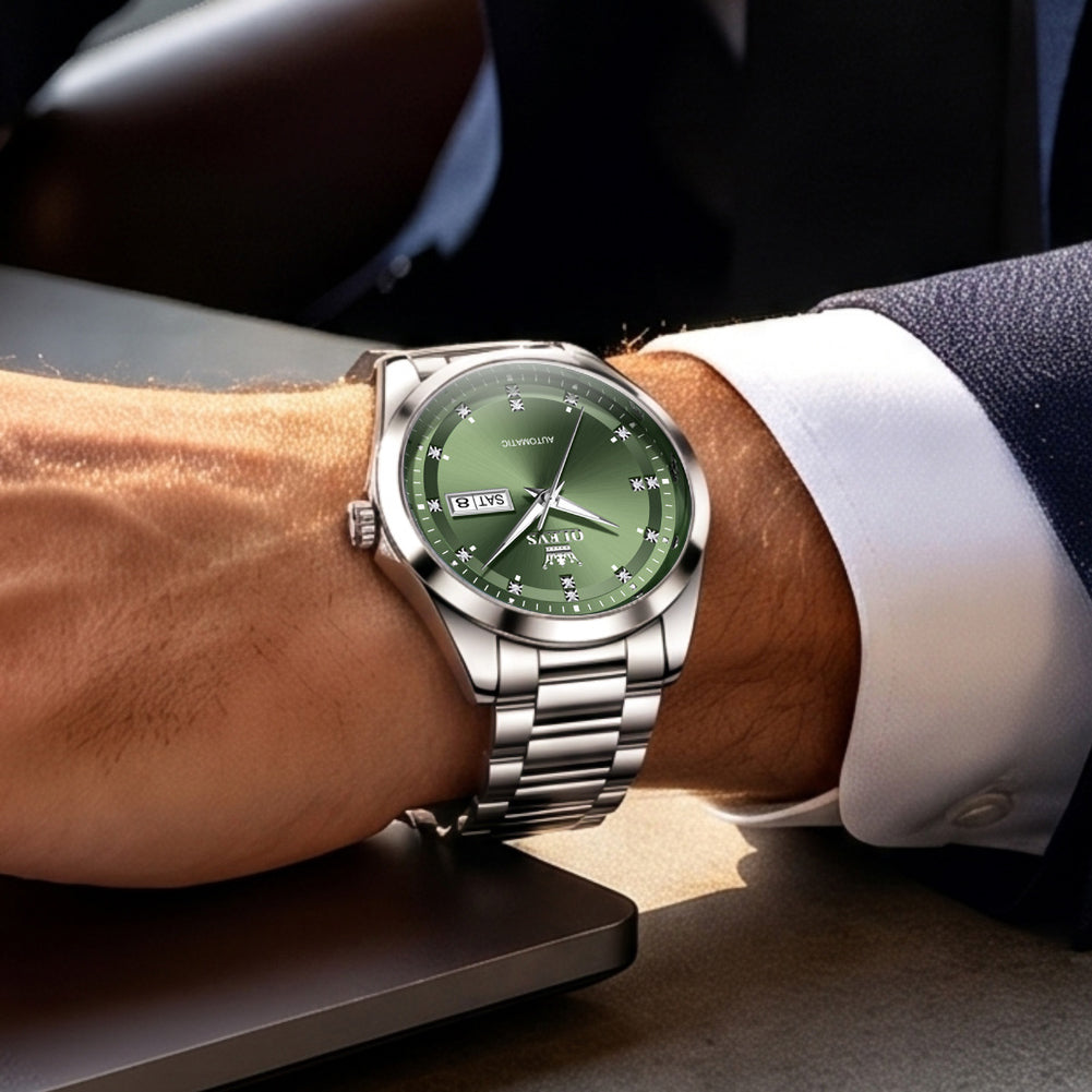 OLEVS 7136 Silver Green watch worn with business attire