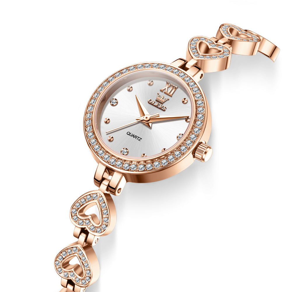 OLEVS 7139 Rose gold tone heart bracelet and dial closeup