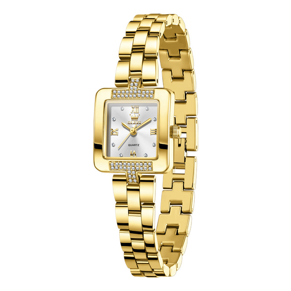 Front view of OLEVS 7141 gold tone women's watch with white dial