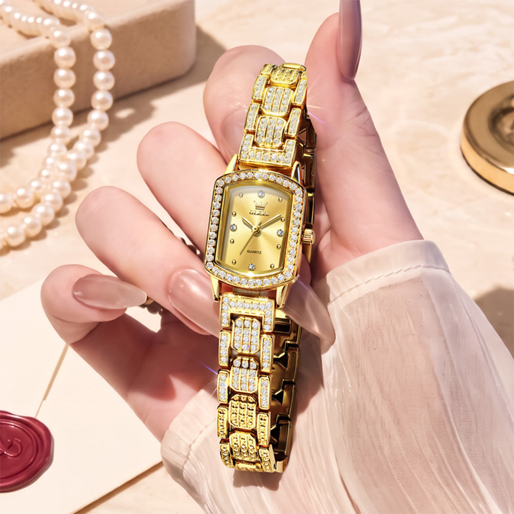 Gold tone OLEVS 7142 women's quartz watch displayed in hand