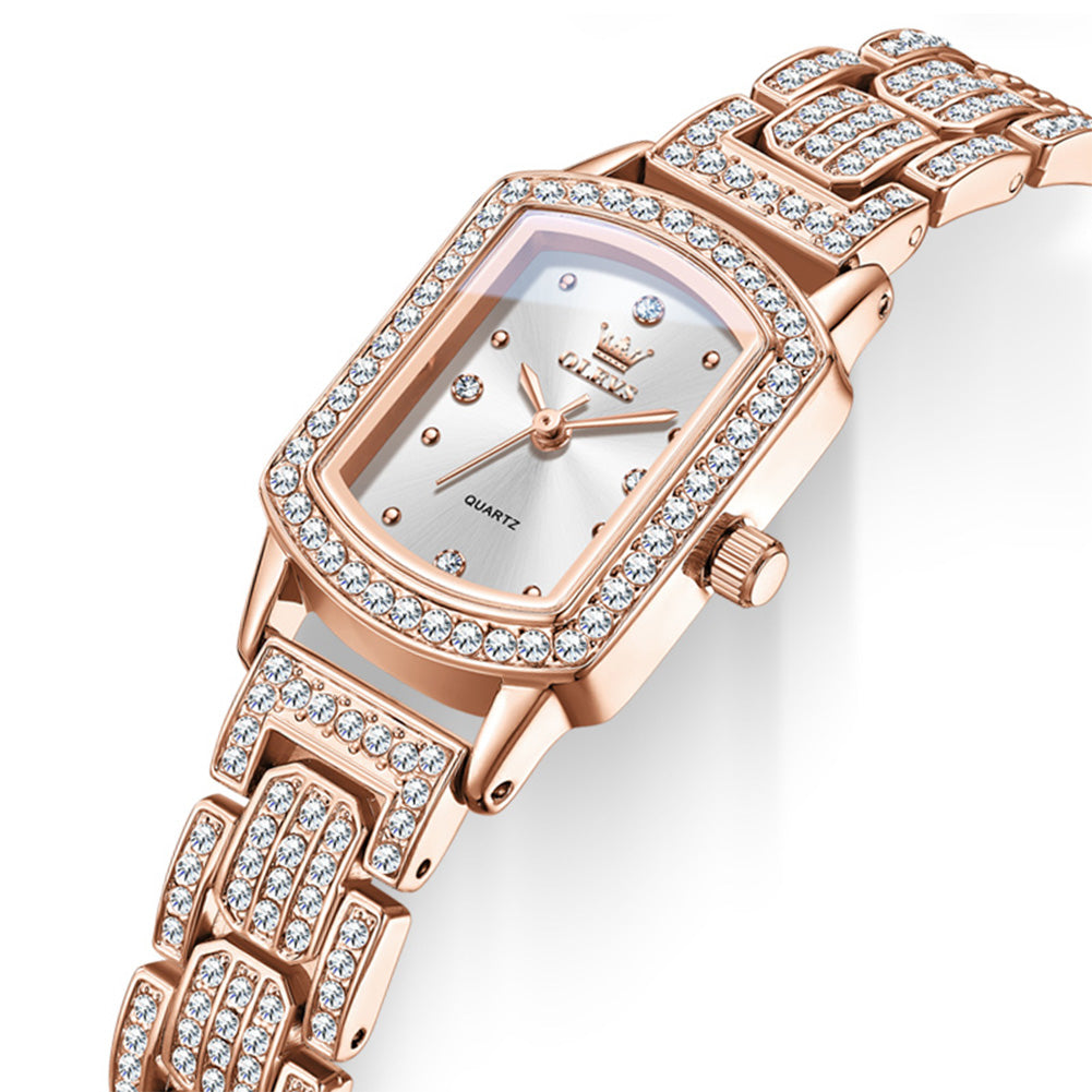 Angled view of OLEVS 7142 rose gold quartz watch showing coated glass and crystal accented bezel