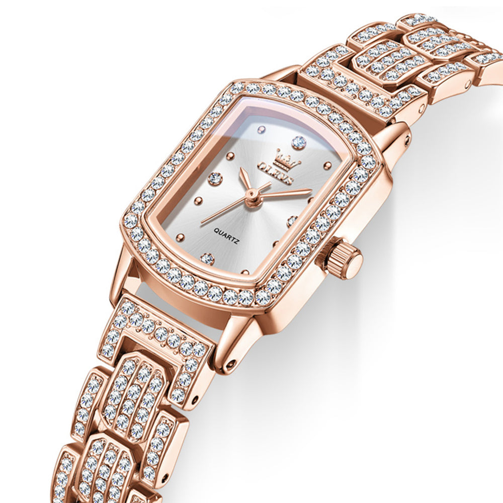 Angled view of OLEVS 7142 rose gold quartz watch showing coated glass and crystal accented bezel